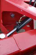 Skid steer clearing snow using Bendall hydraulic snow plow

Bendall 96” red snow plow angled to the side

Close-up of adjustable skid shoes and hydraulic fittings

Rear view of snow blade attached to skid steer

Bolt-on reversible cutting edge on Bendall plow