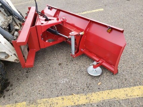 Skid steer clearing snow using Bendall hydraulic snow plow

Bendall 96” red snow plow angled to the side

Close-up of adjustable skid shoes and hydraulic fittings

Rear view of snow blade attached to skid steer

Bolt-on reversible cutting edge on Bendall plow