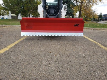 Skid steer clearing snow using Bendall hydraulic snow plow

Bendall 96” red snow plow angled to the side

Close-up of adjustable skid shoes and hydraulic fittings

Rear view of snow blade attached to skid steer

Bolt-on reversible cutting edge on Bendall plow
