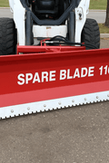 Skid steer clearing snow using Bendall hydraulic snow plow

Bendall 96” red snow plow angled to the side

Close-up of adjustable skid shoes and hydraulic fittings

Rear view of snow blade attached to skid steer

Bolt-on reversible cutting edge on Bendall plow