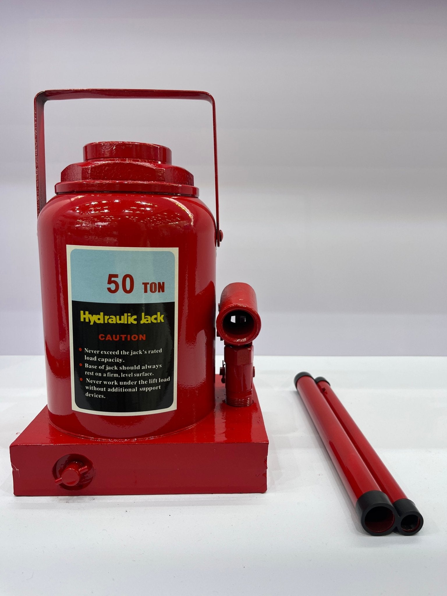 “Heavy-duty hydraulic bottle jack on steel platform”

“30-ton red bottle jack under truck”

“Close-up of 50-ton hydraulic jack with safety pin handle”