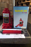 “Heavy-duty hydraulic bottle jack on steel platform”

“30-ton red bottle jack under truck”

“Close-up of 50-ton hydraulic jack with safety pin handle”