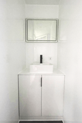 Expandable glass container house with black frame and white kitchen interior

20ft high cube glass container house on an outdoor plot

Modern prefab modular container home with large glass walls

Inside view of the container house kitchen and bathroom setup

portable luxury container home with plumbing and wiring