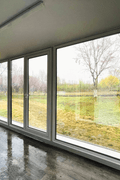 Expandable glass container house with black frame and white kitchen interior

20ft high cube glass container house on an outdoor plot

Modern prefab modular container home with large glass walls

Inside view of the container house kitchen and bathroom setup

portable luxury container home with plumbing and wiring