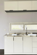 Expandable glass container house with black frame and white kitchen interior

20ft high cube glass container house on an outdoor plot

Modern prefab modular container home with large glass walls

Inside view of the container house kitchen and bathroom setup

portable luxury container home with plumbing and wiring