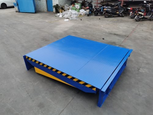 Powered dock leveler showing hydraulic control panel