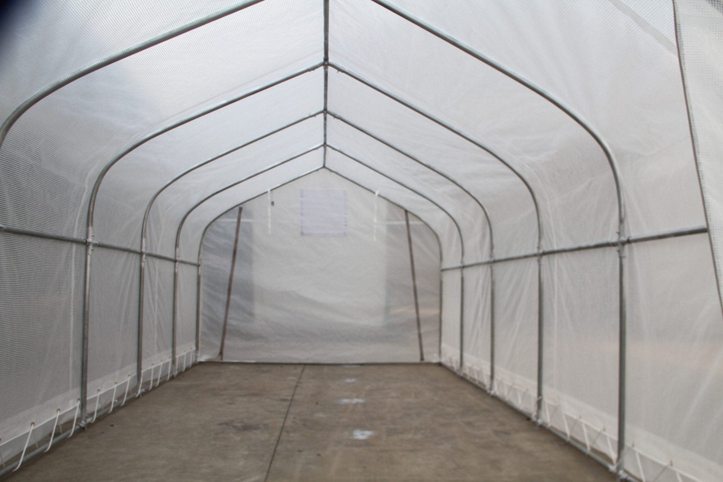 “10x10 walk-in commercial greenhouse with steel frame and canopy”

“Inside view of heavy-duty 10x20 greenhouse for vegetables”

“Zipper door greenhouse for backyard gardening setup”

“Greenhouse tent with reinforced polyester canopy and support frame”