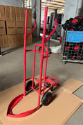 Red tire trolley cart with pneumatic wheels in garage

Heavy-duty tire dolly lifting tire set, ergonomic grip detail, welded frame close-up, tire stack in transit