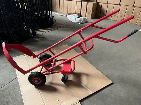 Red tire trolley cart with pneumatic wheels in garage

Heavy-duty tire dolly lifting tire set, ergonomic grip detail, welded frame close-up, tire stack in transit