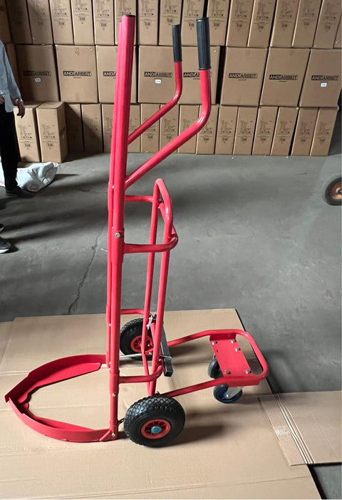 Red tire trolley cart with pneumatic wheels in garage

Heavy-duty tire dolly lifting tire set, ergonomic grip detail, welded frame close-up, tire stack in transit