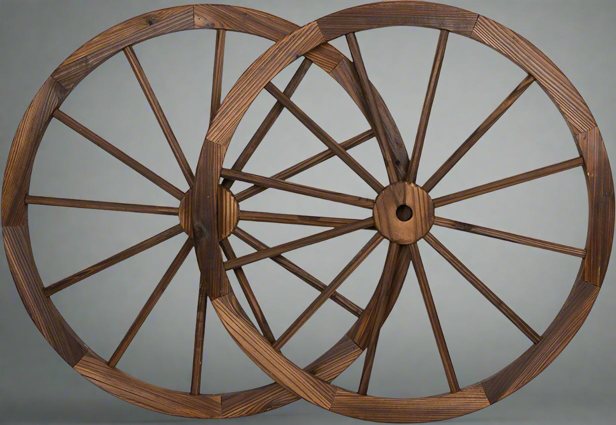 "Rustic wooden wagon wheel 48 inch for garden decor"

"Burnt wood wagon wheel leaning against a fence"

"Farmhouse yard display with decorative wooden wheels"