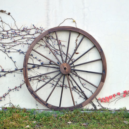 "Rustic wooden wagon wheel 48 inch for garden decor"

"Burnt wood wagon wheel leaning against a fence"

"Farmhouse yard display with decorative wooden wheels"