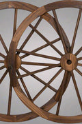 "Rustic wooden wagon wheel 48 inch for garden decor"

"Burnt wood wagon wheel leaning against a fence"

"Farmhouse yard display with decorative wooden wheels"