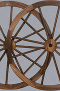 "Rustic wooden wagon wheel 48 inch for garden decor"

"Burnt wood wagon wheel leaning against a fence"

"Farmhouse yard display with decorative wooden wheels"