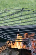 “24-inch campfire swing grill with hanging cooking rack”
• “Steel fire pit grill with adjustable height for outdoor use”
• “Camping fire grill setup over open flame”