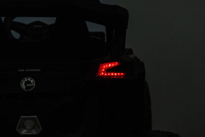 Neon Green 24V Can-Am UTV ride-on car for kids

Side view of Can-Am Maverick electric kids vehicle

Rear suspension view of 2-seater ride-on UTV

LED headlight detail on Can-Am ride-on

Kids ride-on off-road UTV in Neon Pink