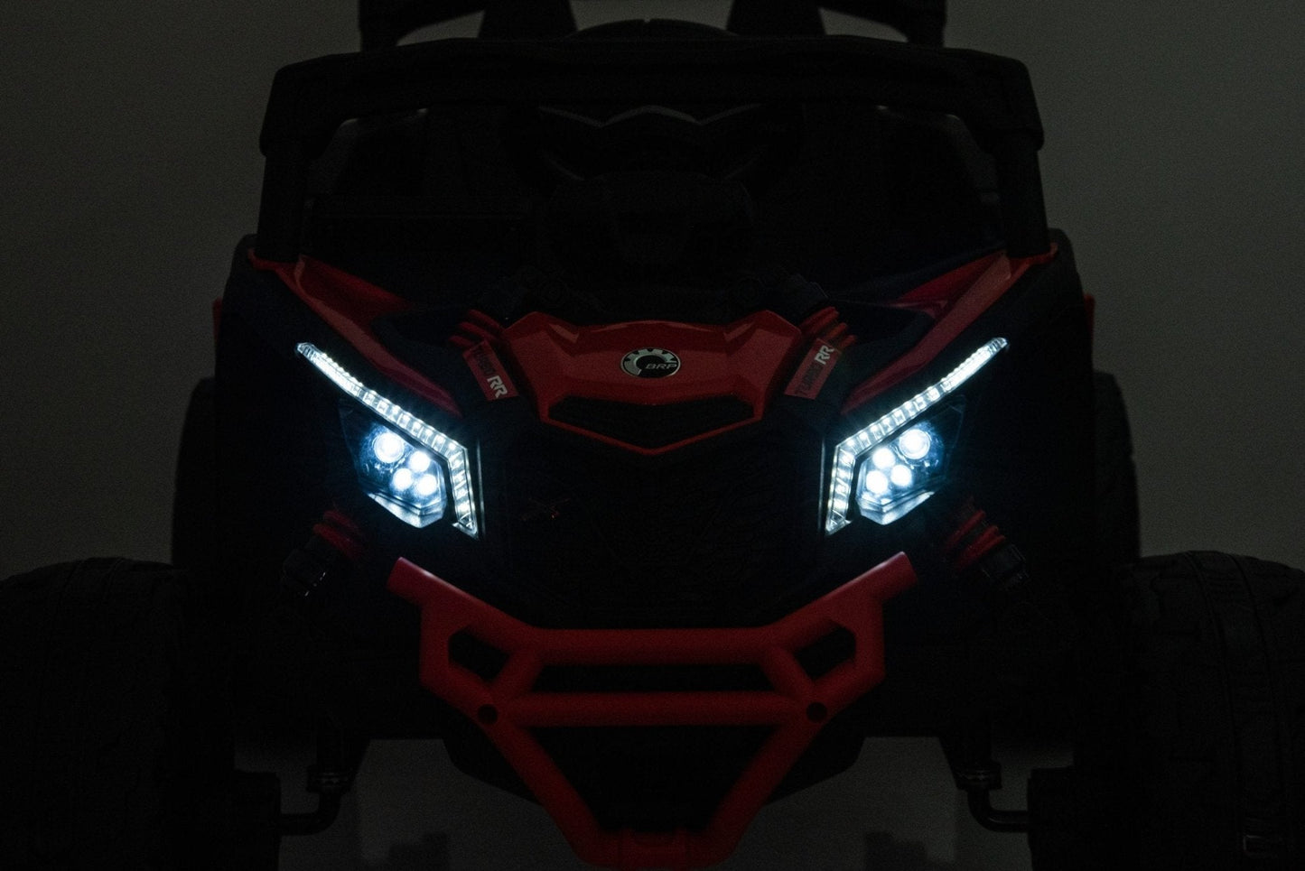 Neon Green 24V Can-Am UTV ride-on car for kids

Side view of Can-Am Maverick electric kids vehicle

Rear suspension view of 2-seater ride-on UTV

LED headlight detail on Can-Am ride-on

Kids ride-on off-road UTV in Neon Pink