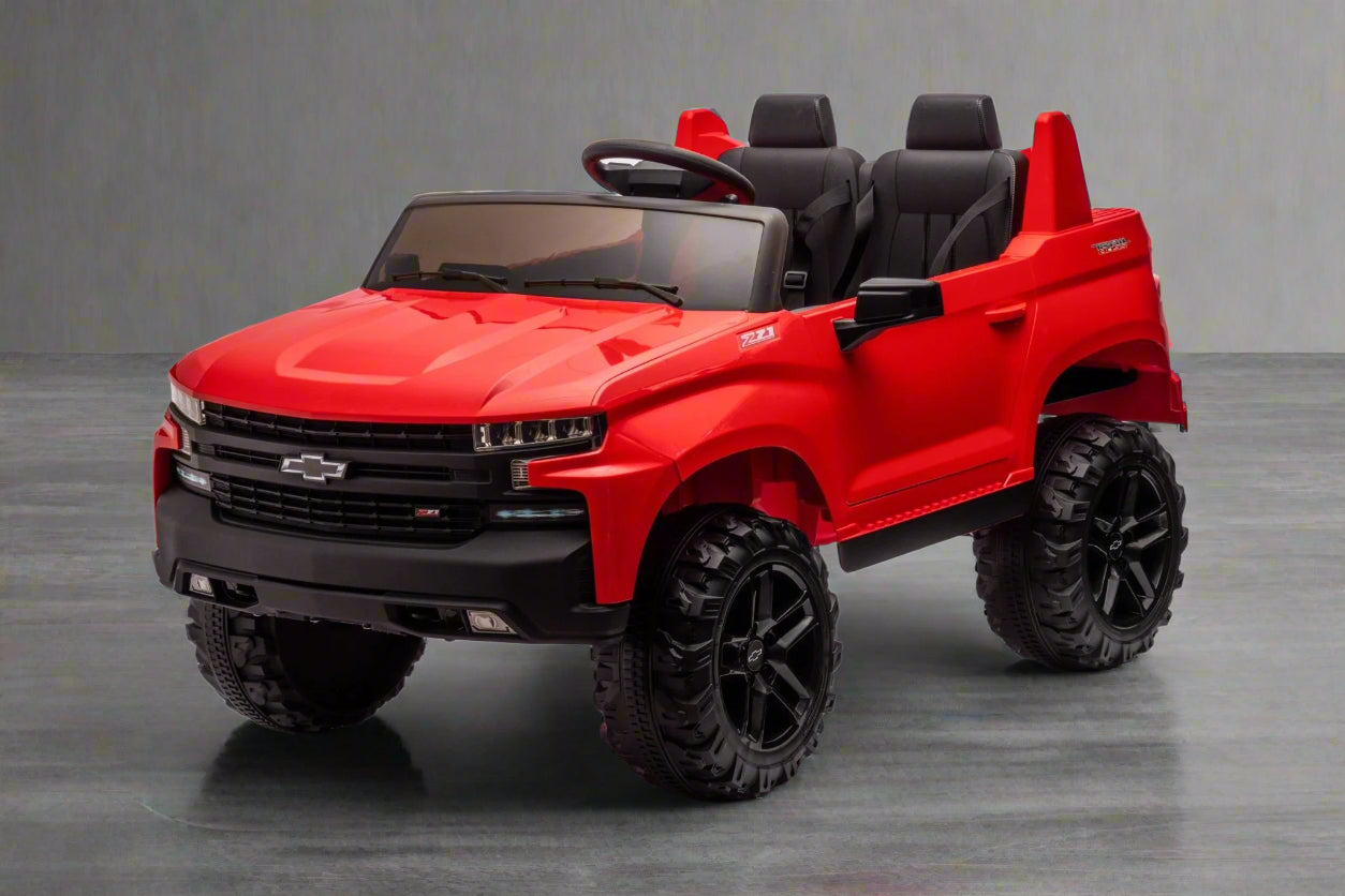 Red Chevrolet ride-on pickup truck for kids with open doors

Front view of Chevrolet kids ride-on with LED lights

Side view of red 24V Chevrolet electric truck toy

Remote-controlled kids electric pickup truck in red

Ride-on truck with Bluetooth and leather seating for children