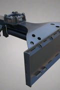 Side view of inverted skid steer log splitter

Front hydraulic wood splitter mounted on skid steer

Splitting log demonstration

Log splitter with couplers and quick attach plate

Hydraulic ram close-up