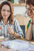 Jewelry making kit full set with pliers and beads

Jewelry tools and findings in plastic organizer

DIY jewelry accessories for crafting

Beads and charms assortment for bracelets

Jewelry-making supplies arranged in tiers

