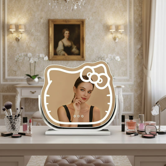 Hello Kitty LED lighted vanity mirror – front view

Oval-shaped pink and white cosmetic mirror on vanity

Mirror lit in 3 different LED color settings

Close-up of Hello Kitty bow design

Free-standing mirror on dressing table