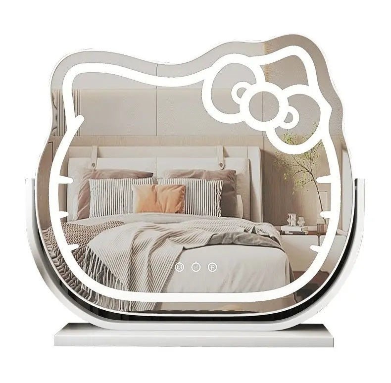 Hello Kitty LED lighted vanity mirror – front view

Oval-shaped pink and white cosmetic mirror on vanity

Mirror lit in 3 different LED color settings

Close-up of Hello Kitty bow design

Free-standing mirror on dressing table