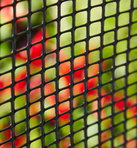 3x15 ft black plastic hardware net roll for garden fencing
Close-up of HDPE chew-proof plastic mesh grid 3/8 inch spacing
Plastic netting around vegetable garden raised beds
Black flexible mesh roll for chicken coops or pet fencing
