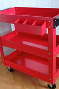 3-layer red steel rolling tool cart with swivel casters and ergonomic handle.
Mobile shop equipment cart with deep trays for tool storage
