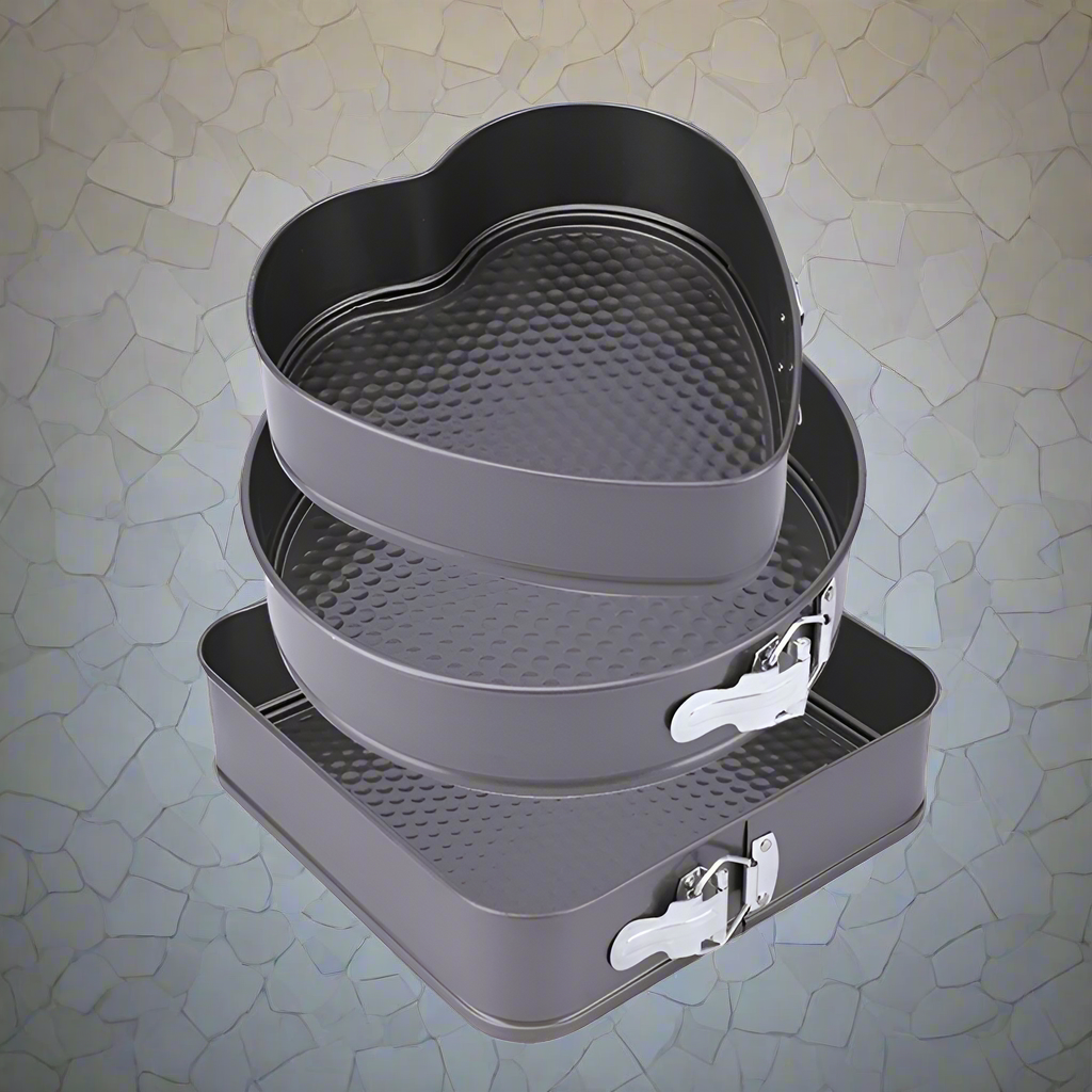 3-piece black non-stick springform pan set stacked

Close-up of leakproof buckle system and honeycomb base

Pan sizes and removable bottoms shown in open position

Full set displayed with baked cake example

Pans nested and stored compactly on kitchen counter