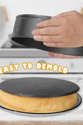 3-piece black non-stick springform pan set stacked

Close-up of leakproof buckle system and honeycomb base

Pan sizes and removable bottoms shown in open position

Full set displayed with baked cake example

Pans nested and stored compactly on kitchen counter