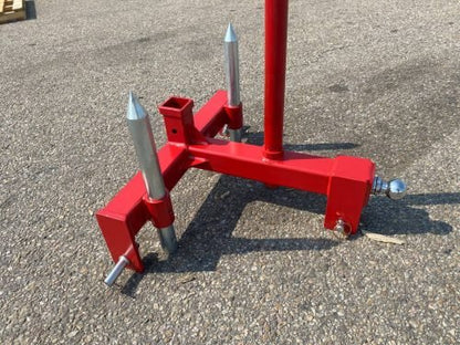 Red 3-point gooseneck hitch with bale spear mount
Tractor trailer hitch attachment with hay spear slots
Reinforced hitch frame for Conus 2 and Conus 1 spear placement
3-point trailer hitch attachment mounted on tractor
Spear holes and 2” trailer receiver on attachment frame