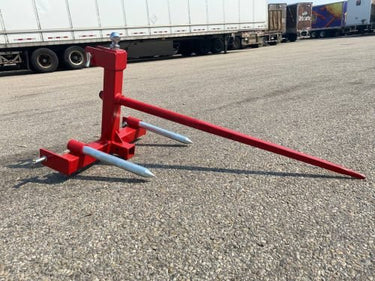 Red 3-point gooseneck hitch with bale spear mount
Tractor trailer hitch attachment with hay spear slots
Reinforced hitch frame for Conus 2 and Conus 1 spear placement
3-point trailer hitch attachment mounted on tractor
Spear holes and 2” trailer receiver on attachment frame