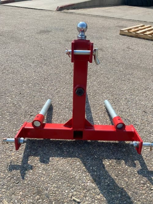 Red 3-point gooseneck hitch with bale spear mount
Tractor trailer hitch attachment with hay spear slots
Reinforced hitch frame for Conus 2 and Conus 1 spear placement
3-point trailer hitch attachment mounted on tractor
Spear holes and 2” trailer receiver on attachment frame