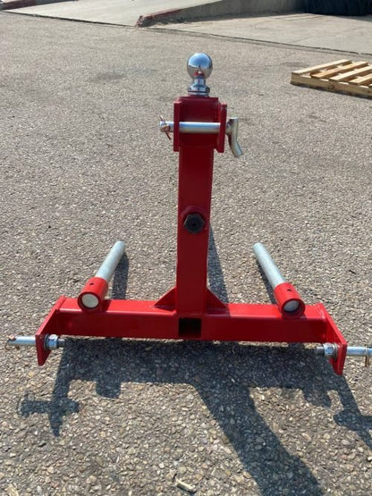 Red 3-point gooseneck hitch with bale spear mount
Tractor trailer hitch attachment with hay spear slots
Reinforced hitch frame for Conus 2 and Conus 1 spear placement
3-point trailer hitch attachment mounted on tractor
Spear holes and 2” trailer receiver on attachment frame