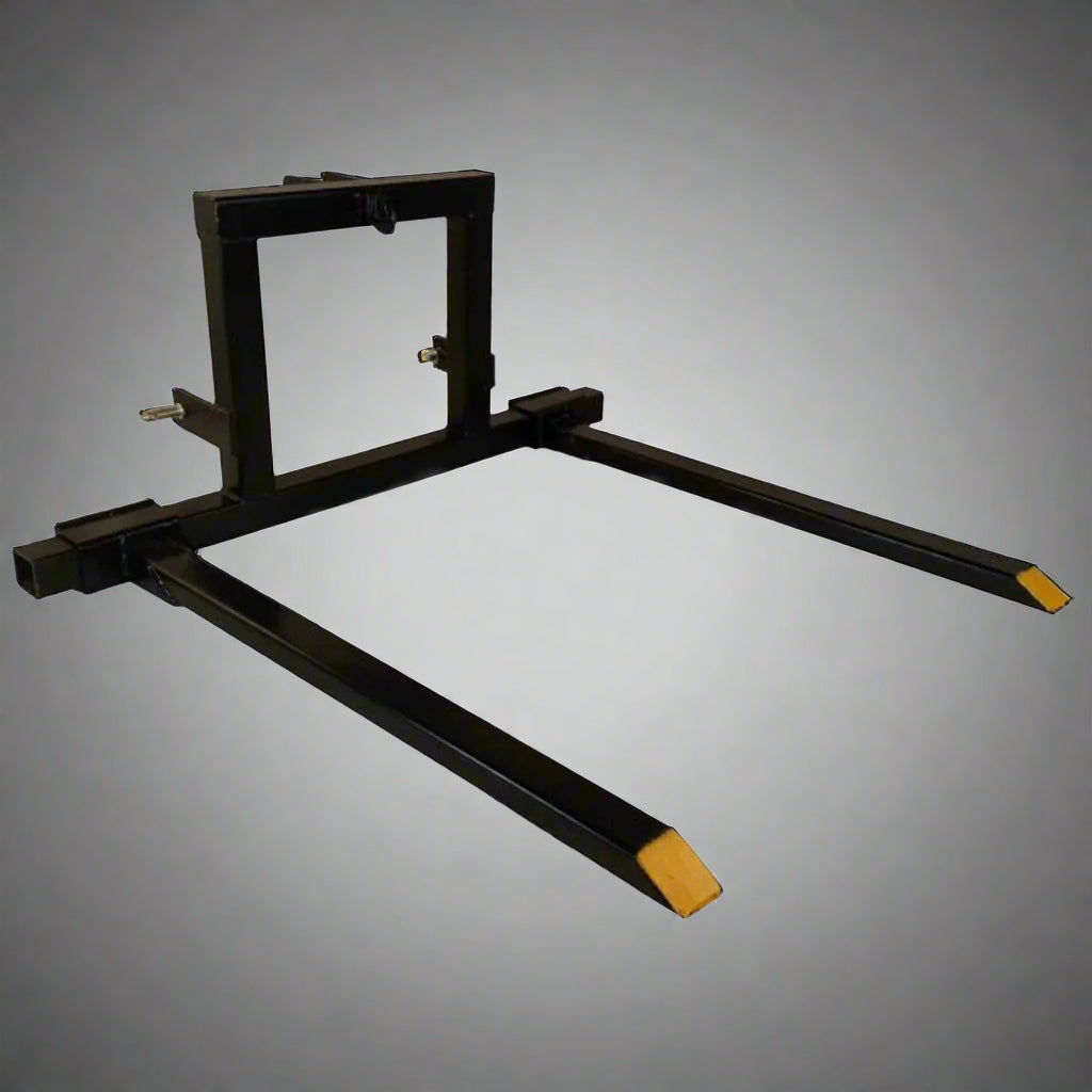 "3-point tractor pallet fork attachment front view – black powder-coated steel"

"Side view of Category 1 tractor hitch pallet fork"

"Closeup of adjustable fork spacing and lock bolts"

"Angled view showing frame and fork mounting points"