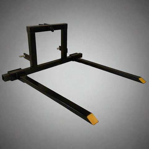 "3-point tractor pallet fork attachment front view – black powder-coated steel"

"Side view of Category 1 tractor hitch pallet fork"

"Closeup of adjustable fork spacing and lock bolts"

"Angled view showing frame and fork mounting points"