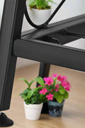 3-tier metal plant stand with potted plants in living room
Black powder-coated plant rack used indoors
Metal flower shelf displayed on outdoor patio
Sturdy decorative stand with three storage tiers
Compact garden shelf holding flowers and décor items
Close-up of black metal frame and assembly