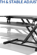 32 inch standing desk riser with keyboard tray
sit-stand workstation converter for office
height adjustable desktop riser setup
ergonomic workstation for dual monitors
home office sit-stand desk converter