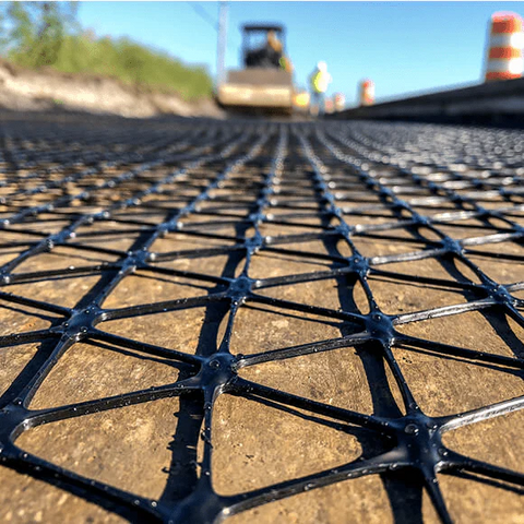 Triangular pattern ground stabilization geogrid close-up

Soil reinforcement geogrid unrolled on construction site

Heavy-duty geogrid used for erosion and slope support

Black polymer geogrid roll for road building

Durable soil fabric mesh on gravel foundation