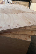 Smooth unmarked pine plywood surface ideal for staining or painting