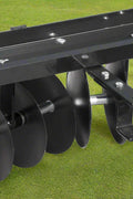 39” tow-behind disc harrow with 8 notched discs – black steel frame
Lawn tractor disc cultivator attachment for garden prep
Tow-behind harrow connected to lawn tractor with pin hitch
Notched disc blades and adjustable angle bracket detail