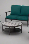 Full 4-piece patio furniture set on lawn

Close-up of swivel chair with cushions

Coffee table with ceramic top

Green loveseat in outdoor setting

Top-down view of all components