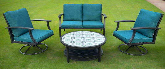 Full 4-piece patio furniture set on lawn

Close-up of swivel chair with cushions

Coffee table with ceramic top

Green loveseat in outdoor setting

Top-down view of all components
