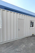Exterior view of 40 FT insulated container office cabin

Interior layout showing vinyl flooring and workstations

TPS insulated walls and faux leather trim details

Plumbing and water system built into mobile cabin

Rear angle showing door and window design