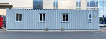 Exterior view of 40 FT insulated container office cabin

Interior layout showing vinyl flooring and workstations

TPS insulated walls and faux leather trim details

Plumbing and water system built into mobile cabin

Rear angle showing door and window design
