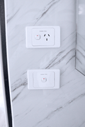 Close-up of installed toilet and bathroom wall paneling