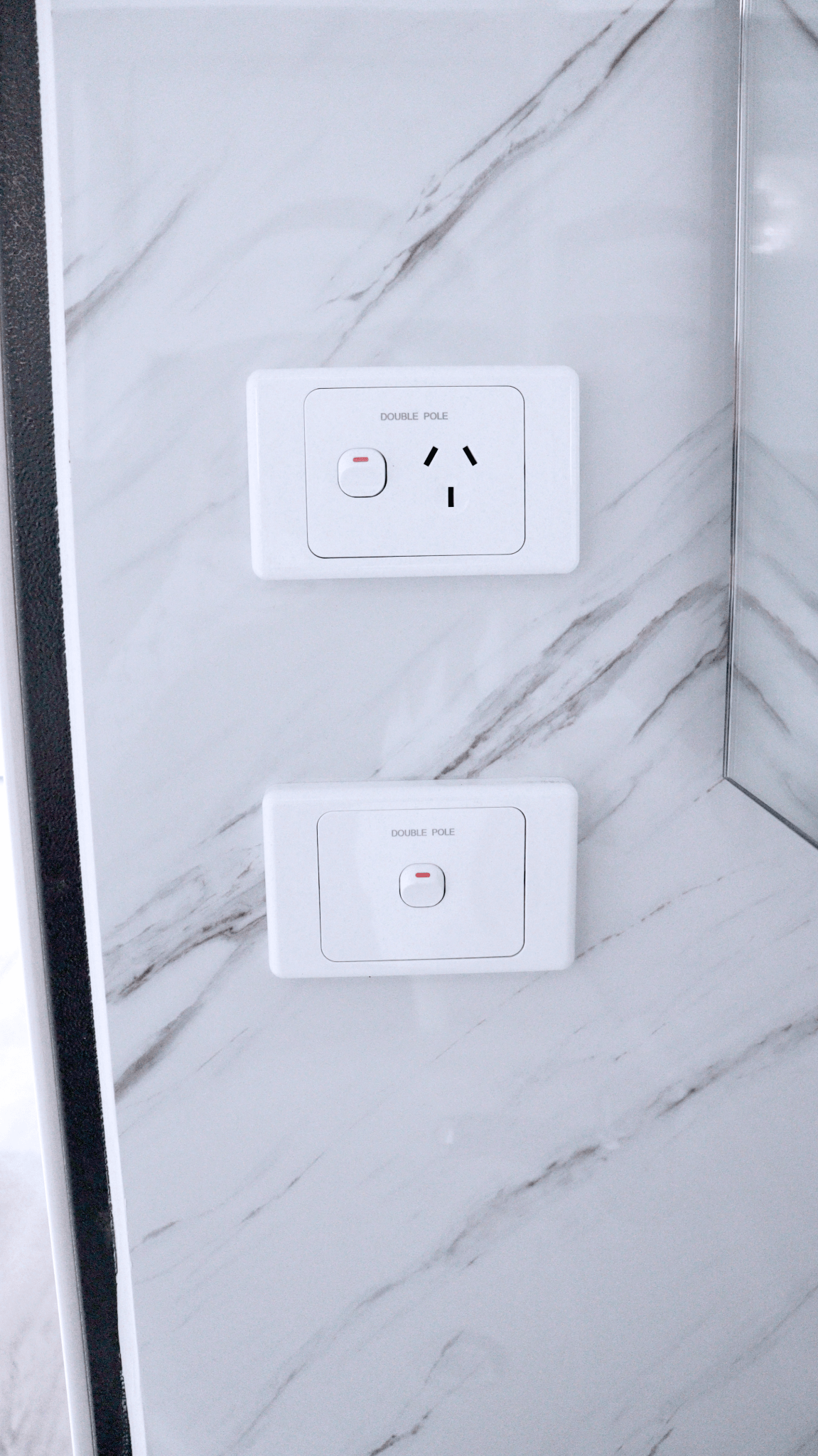 Close-up of installed toilet and bathroom wall paneling