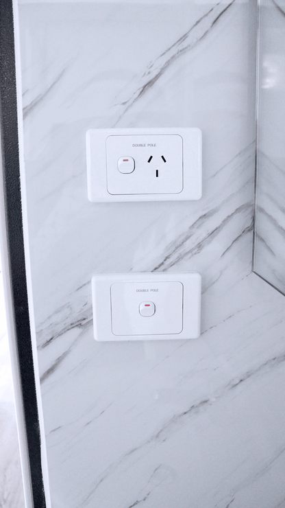 Close-up of installed toilet and bathroom wall paneling