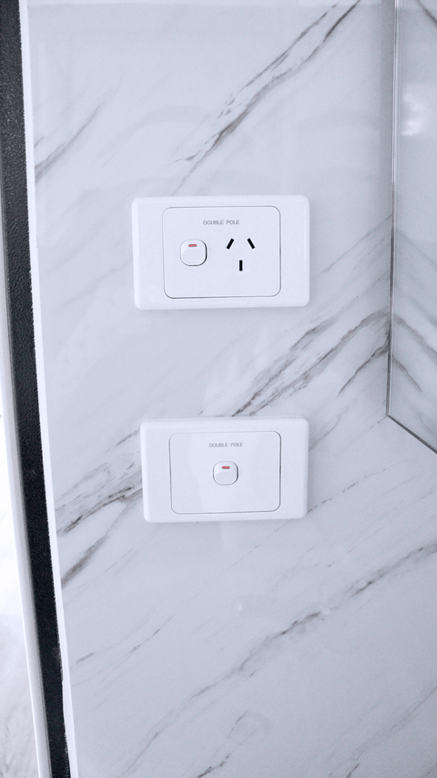 Close-up of installed toilet and bathroom wall paneling