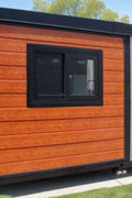 Front view of 40FT off-grid folding house, set on leveling blocks